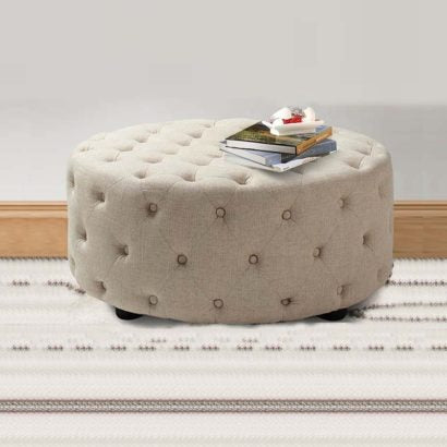 Round Button Tufted Ottoman with plush cushioning and elegant button tufting for refined home decor.